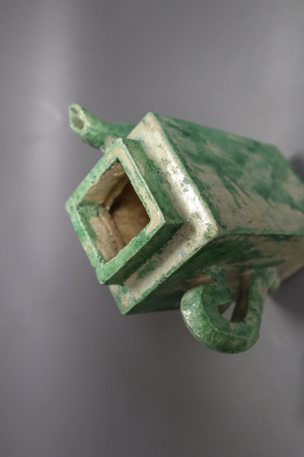 A Chinese green glazed square tea or wine pot, Ming dynasty, 18cm high